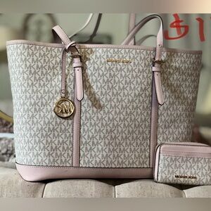 MK large tote with multi pocket supper clean hardly used , has a zipper wallet